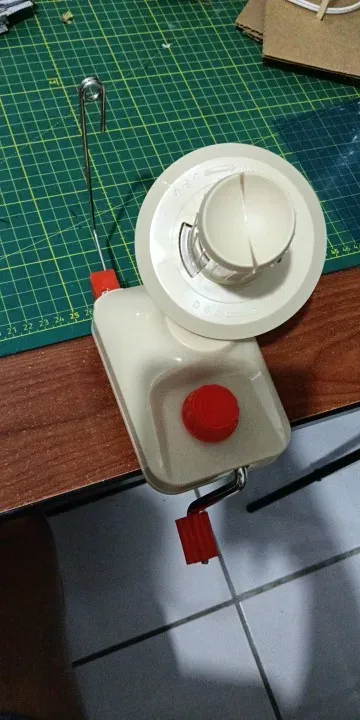 Skeinwright ball winder standing on a cutting mat before winding, photographed by a verified buyer